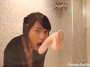 Babe penetrates her cunt with a big dildo in a shower